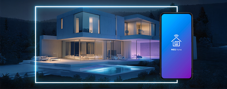 Casa moderna à noite com áreas iluminadas e smartphone com app WEG Home em destaque, sugerindo gestão de energia e automação. 